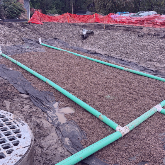 Storm sewer pipe installation on a construction site